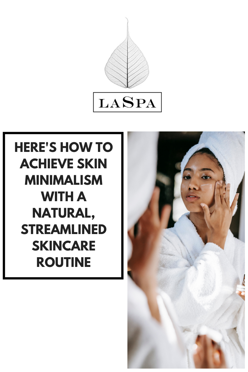 A black woman applying LASPA SPF 30 sunscreen her face